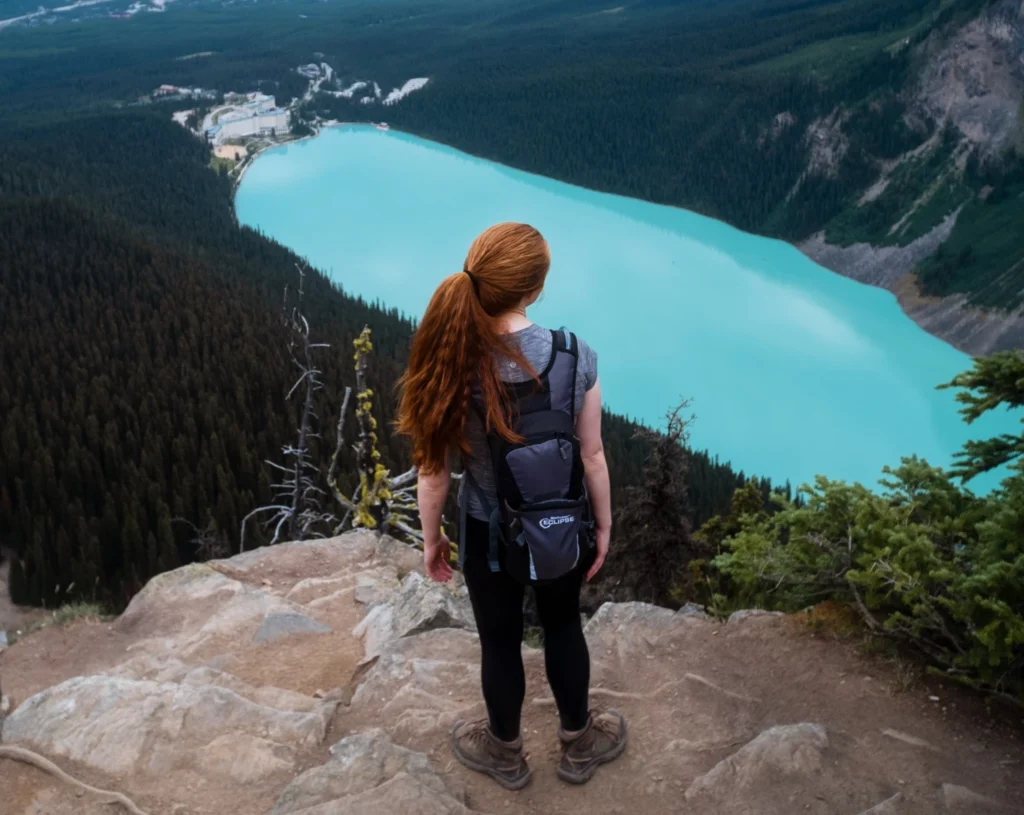 woman standing on a cliff